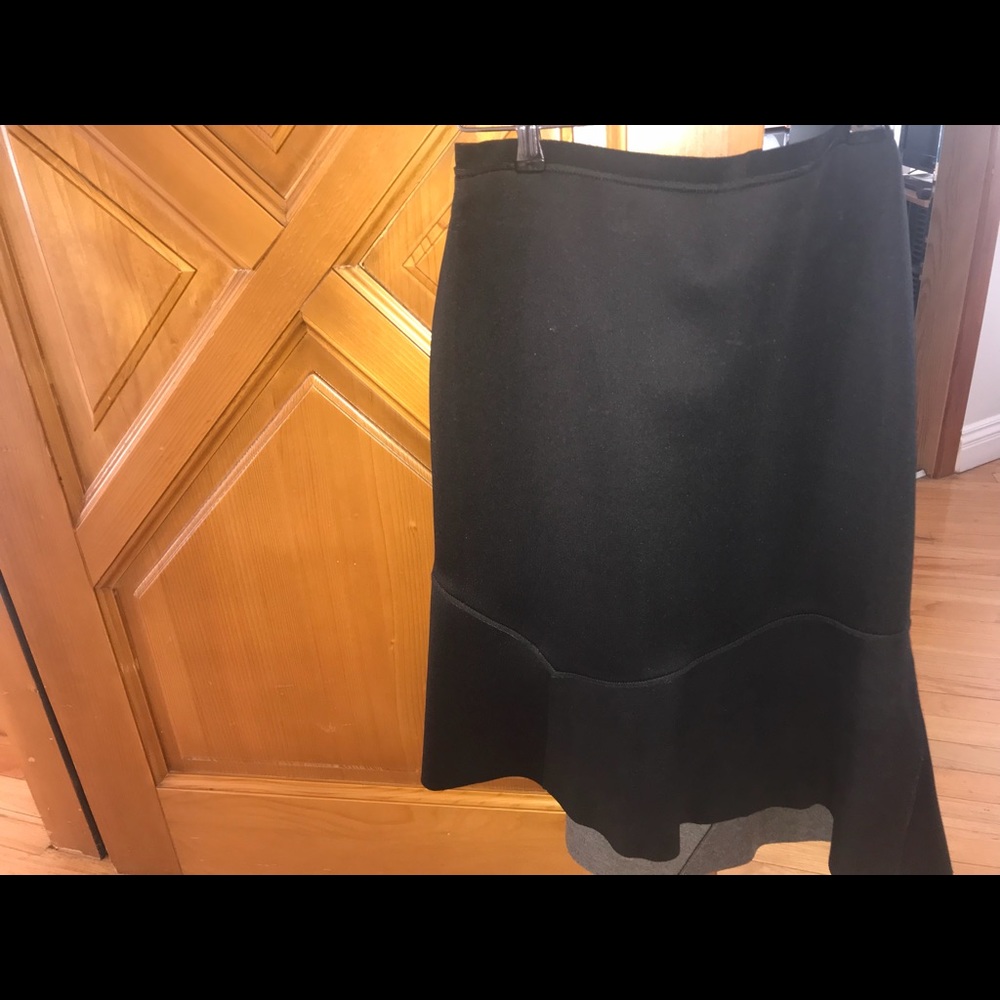 A brand new designer skirt with leather inserts